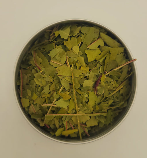 Dried peach leaf in metal dish