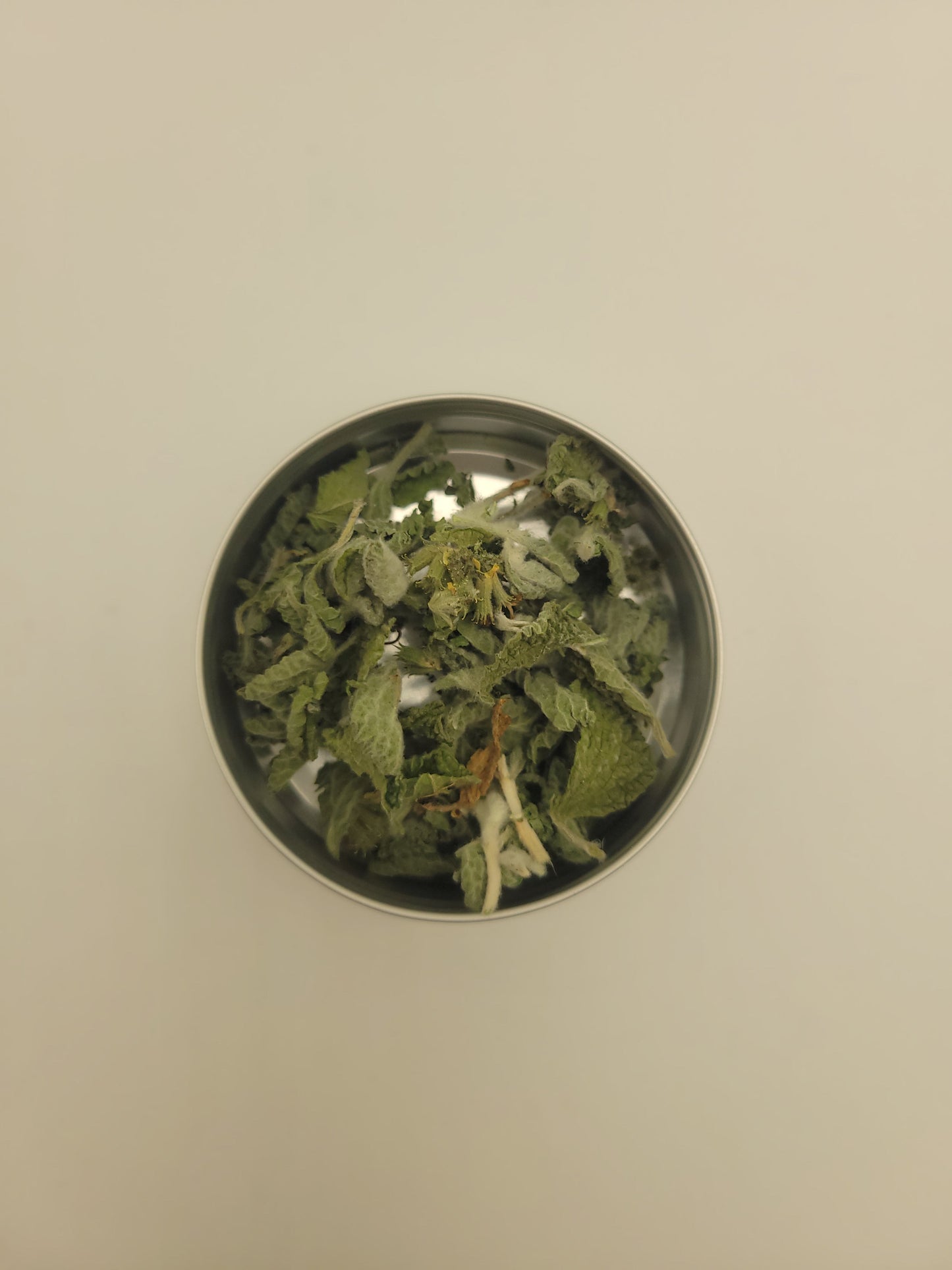 Dried horehound in a small metal bowl